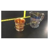 Carnival glass pieces pitcher and cup
