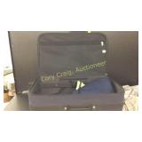 Luggage with rollers had three shirts and Jacket