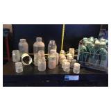 Old glass jars, cup full of pennies, Insulators