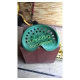 Tractor seat  attached to a tool caddy with on