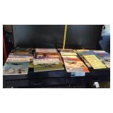 Tote full of War plane calendars and magazines