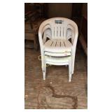 Four White Plastic chairs
