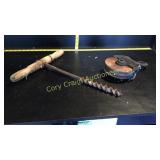 Old wooden pulley and primitive drill