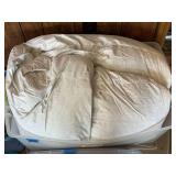 White Bedding Comforter in Plastic Storage Bin