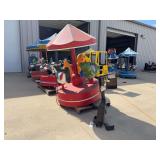 Coin-Operated Children's Carousel Ride with Animal Figures