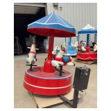 Coin-Operated Children's Carousel Ride with Three Horses