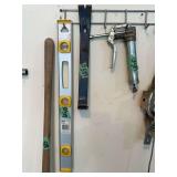 Lot of Assorted Tools Including Stanley Level, Grease Gun, and Pry Bar