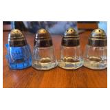 Set of Four Pressed Glass Salt Shakers with Metal Tops