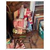 Assorted Fabric Dolls and Textiles on Wooden Chair