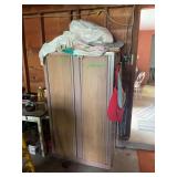 Metal Storage Cabinet with Assorted Garments