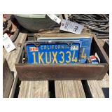 California License Plate Collection in Metal Bin