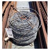 Coil of Barbed Wire Fencing