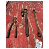 Assorted Hand Tools Including Bolt Cutters, Pipe Wrench, and Lug Wrench