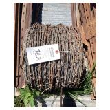 Coil of Barbed Wire Fencing