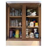 Assorted Kitchen Cabinet Contents Including Glassware, Mugs, Bowls, and Plates