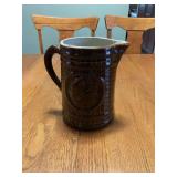 Brown Glazed Stoneware Pitcher with Basketweave Texture and Medallion