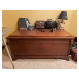 Wooden Storage Chest with Carved Accents and Keyhole