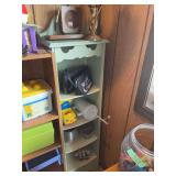 Green Open Shelf Display Unit with Assorted Collectibles and Decor