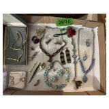 Assorted Costume Jewelry Lot Including Necklaces, Brooches, and Earrings