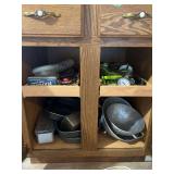 Assorted Kitchen Utensils, Flatware, and Baking Equipment in Wooden Cabinet Storage