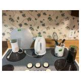 Kitchenware Assortment Including Electric Kettle, Coffee Grinder, Pizza Peel, and Utensil Holder