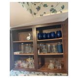 Assorted Kitchen Cabinet Contents Including Glassware, Mugs, Bowls, and Utensils