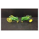 2 John Deere tractors, 1 cast iron John Deere