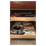 Cabinet of baking pans, skillet, and electric