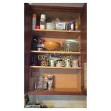 Cabinet of lightbulbs, coffee cups, bowls,