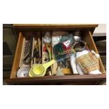 Drawer full of miscellaneous kitchen items