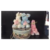 Hat box with 3 stuffed bunnies