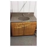 Bathroom sink and cabinet 37" wide 22" deep 30.5"