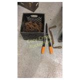 Assorted lof chains, pruners, and draw knife