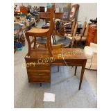 Singer sewing machine in cabinet with cane bottom