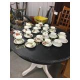 Christmas cups and saucers and regular cups and