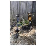 2 golf bag carts and a golf caddy