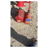 2 gas cans and 1 funnel one has a little in it