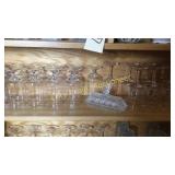 Shelf of glasses and butter dish