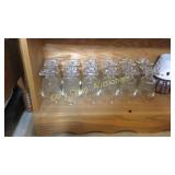 Shelf of glasses and candles