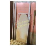 Ironing board, flag, broom, mirror, shower