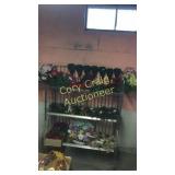 2 stands full of greenery and flowers. STANDS N