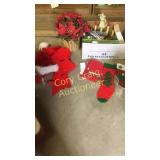 Box of Christmas towels, stockings, bows, hat,