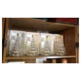 Lighted up Christmas trees. They all work