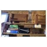 Contents of both shelves items on work bench and