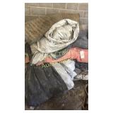 Rubber mat and an assortment of tarps