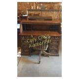Roll top desk with swivel chair