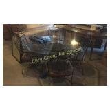 Glass top table leaver top chairs (4) wrought iron