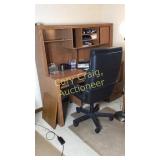 Office desk with misc and chair and mat