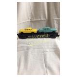 Lionel No. 6424 flatcar with (2) automobiles