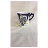 Very old Flow Blue cup, elegant form, incised on